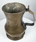 George II period brass drinking tankard with rounded baluster form, flared rim, and naturally aged surface patina.