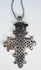 Ethiopian Coptic cross pendant showcasing intricate geometric symbolism and historic Christian craftsmanship.