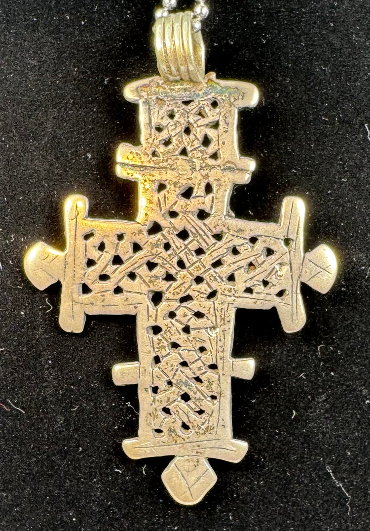 Large Ethiopian Coptic cross pendant with detailed latticework, handcrafted in the traditional Orthodox style.