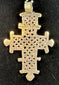 Large Ethiopian Coptic cross pendant with detailed latticework, handcrafted in the traditional Orthodox style.