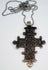 Silver-tone Ethiopian Orthodox cross pendant with ornate openwork decoration and large hanging loop.