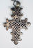 Traditional Ethiopian Orthodox Christian cross pendant featuring elaborate geometric openwork craftsmanship.