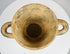 Ancient Etruscan cup with geometric motifs and archaeological wear