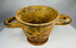 Archaic period Etruscan pottery vessel with twin handles and pedestal foot