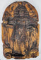 Weathered European religious wood carving with a robed saint beneath a rounded ornamental arch