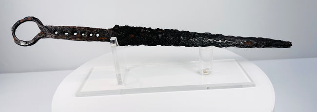 Historic European fighting dagger from the 14th century with iron hilt and prominent quillons