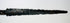 Close-up of 14th-century European dagger blade with heavy corrosion and pitted surface, displayed flat on a white background.