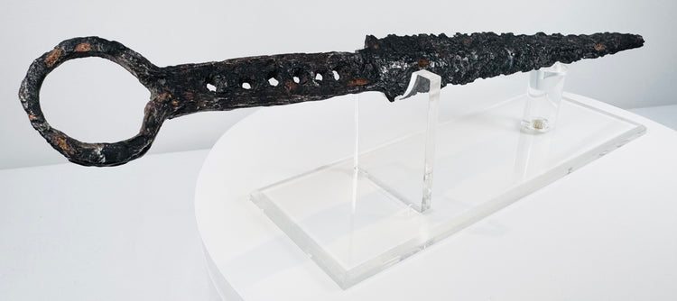 Close view of antique quillon dagger showing centuries-old patina, corrosion and medieval ironwork