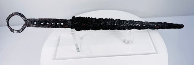 Antique medieval quillon dagger with tapered thrusting blade and distinctive circular ring pommel