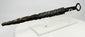 Medieval European dagger with ring pommel and corroded forged steel blade on acrylic display stand — 14th-century weapon artifact photographed on white background.