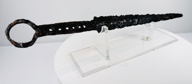 Rare medieval European dagger with forged blade, pierced grip section and circular iron pommel
