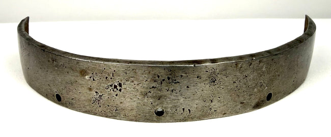 17th century European forged steel armor band with weathered texture and mounting holes