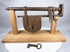 Antique warded iron key beside an 18th-century sliding hasp door lock