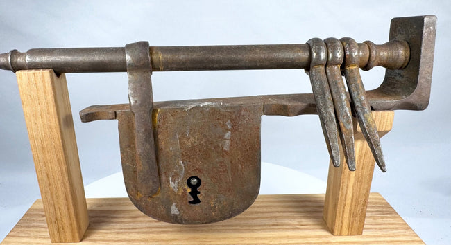 Close-up of the heavy wrought-iron lock body with traditional keyhole opening