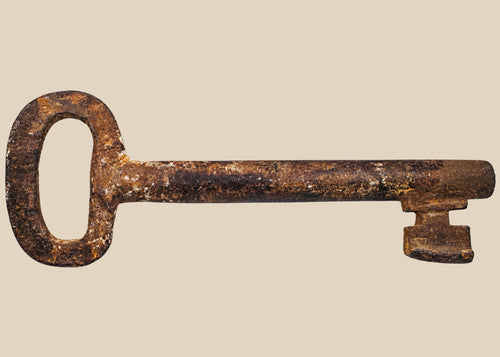 18th-century European forged iron skeleton key with oval bow, wedge-shaped ward, and developed patina, used for warded locks in manors, castles, or estates.
