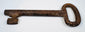 Early European warded-lock key in forged iron, circa 18th century, with age-related surface wear and preserved form.
