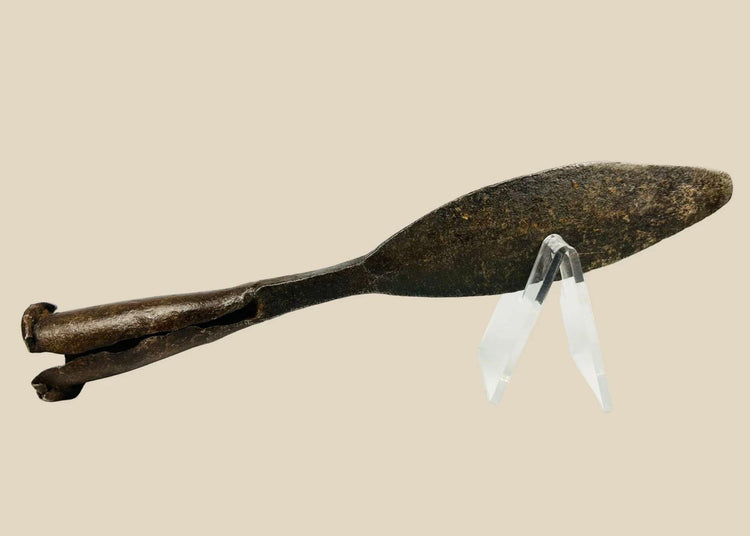 Antique European iron socketed spearhead, 18th century or earlier, featuring a double-edged leaf-shaped blade and rolled socket base. The piece shows natural patina and age-related wear, reflecting historic craftsmanship and its use in hunting, warfare, and ceremonial contexts.