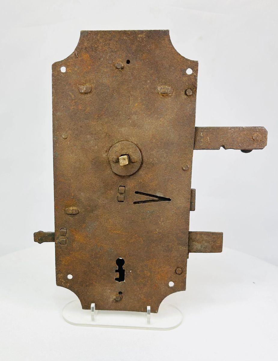 18th century European hand-forged iron door lock with exposed keyhole and aged patina