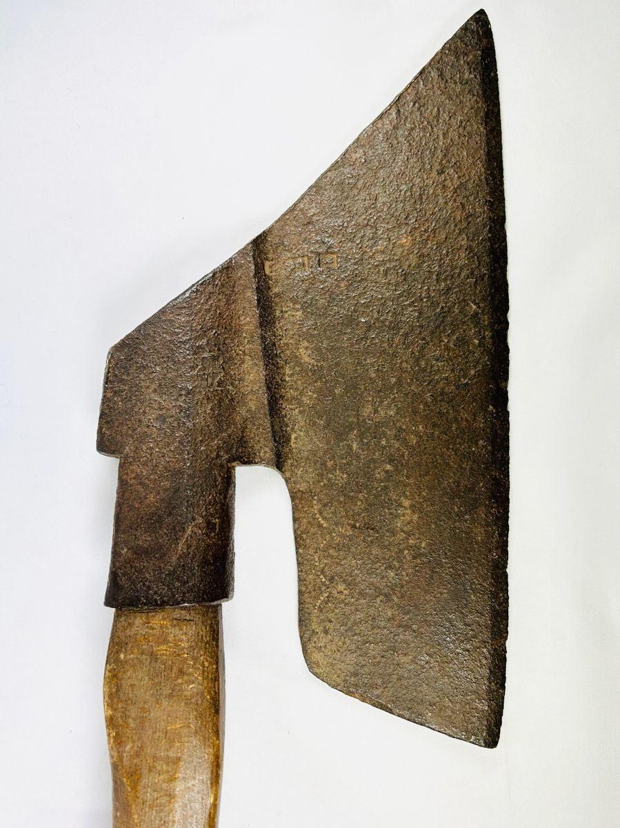 Antique European forged iron axe with wooden handle, featuring a leaf-shaped blade and tapered edge. Exhibits natural patina and surface wear consistent with 18th–19th century use, reflecting historical craftsmanship and utilitarian design.