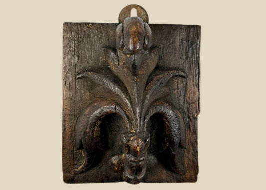 Small 16th-century European carved wooden devotional panel depicting the Pelican in Her Piety with zoomorphic scrollwork and traces of polychrome paint, Renaissance period.
