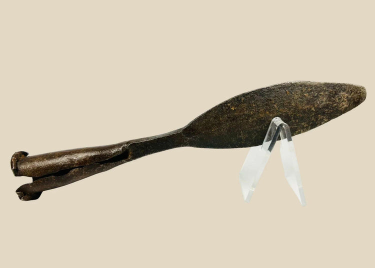 Antique European iron socketed spearhead, 18th century or earlier, featuring a double-edged leaf-shaped blade and rolled socket base. The piece shows natural patina and age-related wear, reflecting historic craftsmanship and its use in hunting, warfare, and ceremonial contexts.