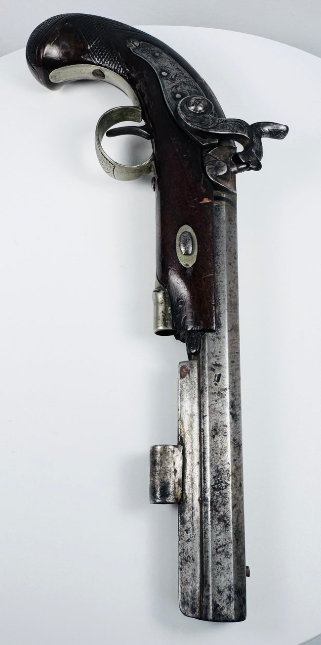 Fenton London antique percussion pistol showing engraved lock, hammer and octagonal steel barrel