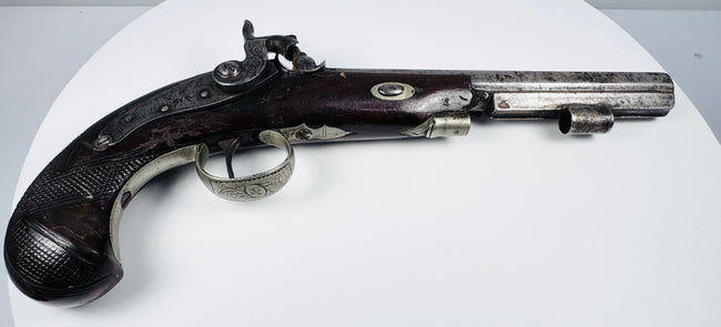 Side view of 19th-century English percussion pistol by Fenton of London with checkered walnut grip