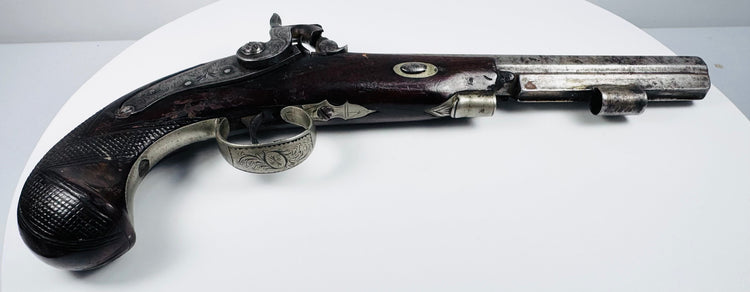 Antique English percussion pistol displayed from the side showing full 14-inch profile