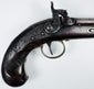 Close-up of engraved steel lockplate on antique Fenton London percussion pistol