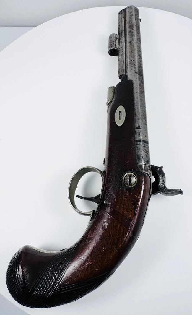 Opposite side of 19th-century Fenton of London pistol with curved walnut grip and percussion mechanism