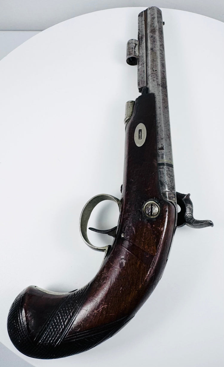 Opposite side of 19th-century Fenton of London pistol with curved walnut grip and percussion mechanism