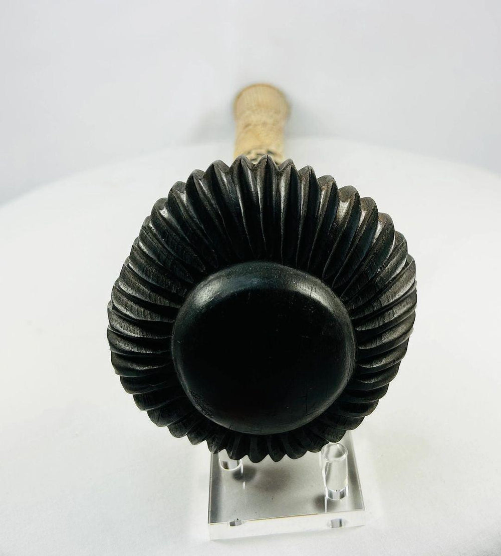 Fijian ula throwing club, circa 19th–20th century, carved hardwood with flared striking head and woven fiber grip decoration.