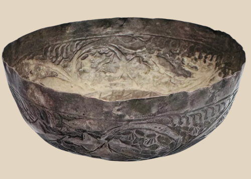 Medieval Seljuk silver unguent bowl from Persia dating to the 12th–13th century, featuring finely engraved floral and geometric decoration.