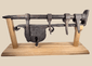 Large 18th-century European wrought-iron sliding hasp gate lock on a wooden display stand