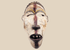 Mid-20th-century Yombe wooden mask with white pigment and red-purple facial stripe