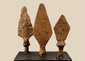 Set of three antique iron projectile points with elongated, leaf-shaped, and diamond-shaped blades, Roman to Medieval period.