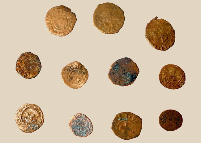 Collection of eleven medieval Crusader-era copper-alloy coins attributed to the Levant, dating to circa 11th–13th century CE.