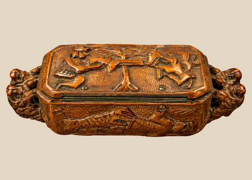 Antique Italian hand-carved hardwood table snuff box from the late 19th century, circa 1870–1900, featuring elaborate hunting and mythological relief carvings.