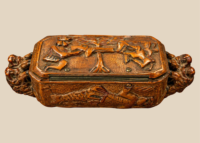 Antique Italian hand-carved hardwood table snuff box from the late 19th century, circa 1870–1900, featuring elaborate hunting and mythological relief carvings.