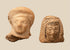 Pair of ancient terracotta female head fragments attributed to Etruscan and East Greek artistic traditions, circa 550–300 BCE.
