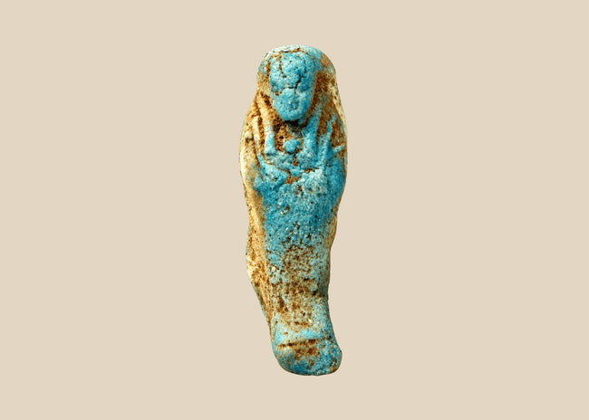 Ancient Egyptian turquoise-blue faience ushabti funerary figure, circa 664–30 BCE, featuring a traditional mummiform body and sculpted facial features.