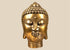 Mid-20th-century cast copper-alloy Buddha head sculpture featuring a serene expression, spiral hair curls, elongated earlobes, and a warm golden finish.
