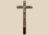 18th-century French peddler’s crucifix with embossed lead religious figures mounted on a dark-painted pine wooden cross.