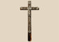 18th-century French peddler’s crucifix with embossed lead religious figures mounted on a dark-painted pine wooden cross.