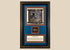 Ancient Egyptian Eye of Horus amulet dating to 663–304 BCE, mounted in an ornate framed historical display.