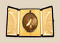 Late Victorian sepia photographic portrait of a woman displayed in an open black velvet folding presentation case, circa 1895–1915.