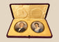 Pair of Victorian–Edwardian colour portrait miniatures of a gentleman and woman displayed in an open burgundy leather case, circa 1880–1910.