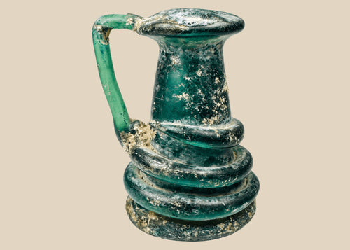 Late Roman blue-green glass jug with applied coiled trail decoration and iridescent burial patina