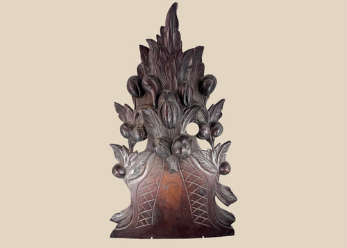 Antique European Black Forest-style carved wood furniture crest with overflowing fruit basket, foliage and deep reddish-brown patina