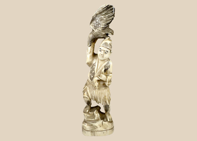 Antique Japanese falconer okimono with a large bird of prey, circa 1890–1920